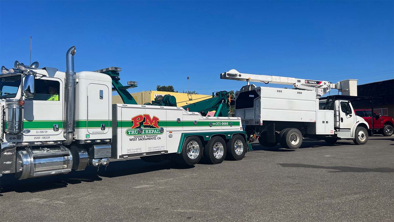 breakdowns-happen Forestry truck being towed by a tow truck
